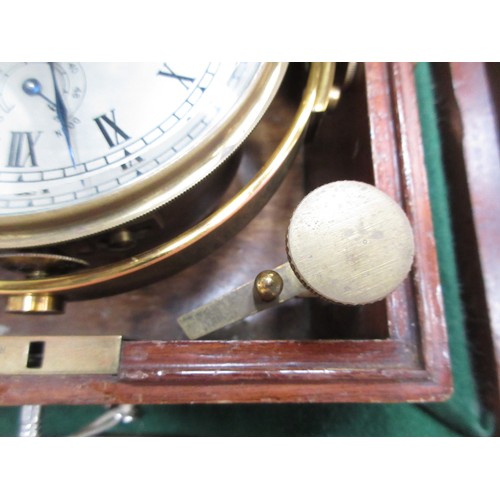 392 - A brass marine Chronometer by Thomas Mercer, St Albans, with silvered dial with Roman numerals and t... 