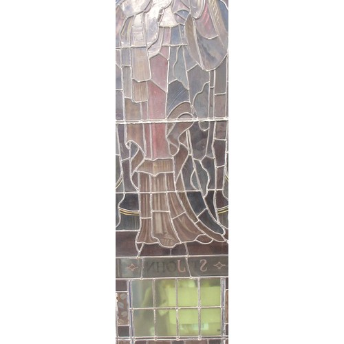 499 - A late 19th Century coloured leaded glass church Window depicting St John in modern oak frame 11ft 6... 