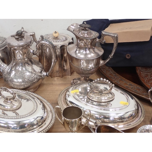 568 - A stoneware red glazed Coffee Set, five Bowls and a leaf shaped Dish