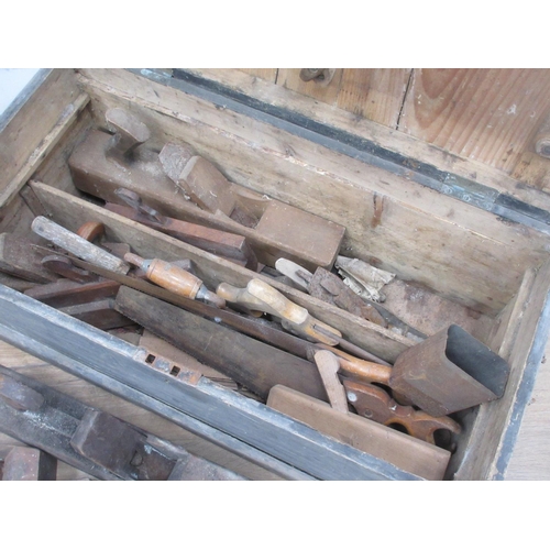 104 - An antique pine Tool Chest containing carpenter's Tools