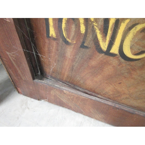 11 - A Victorian mahogany door with painted lettering 'J.W. Arkell & Sons, Chemists' and a pair of glazed... 