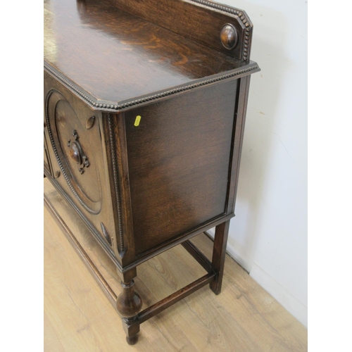 123 - A moulded oak Sideboard fitted three drawers and a cupboard door 3ft 9in W x 3ft 6in H