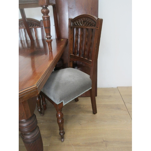 132 - A Victorian walnut extending Dining Table with three spare leaves mounted upon turned and fluted sup... 