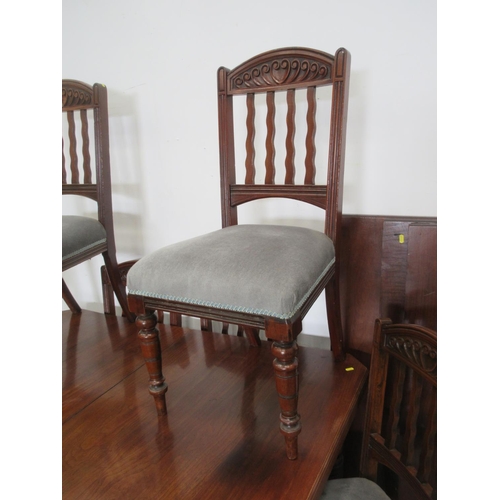 132 - A Victorian walnut extending Dining Table with three spare leaves mounted upon turned and fluted sup... 