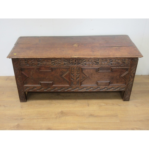 146 - A late 17th or early 18th Century Coffer with moulded lid above leafage carved frieze initialled E.W... 