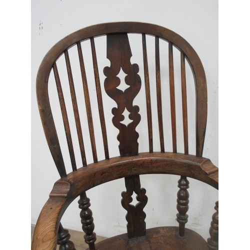 149 - A 19th Century ash and elm broad arm Windsor Armchair with pierced splat back 3ft 9in H