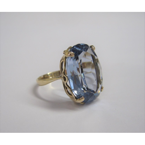 170 - A synthetic Blue Spinel Dress Ring claw-set large oval-cut stone in 9ct gold, ring size Q