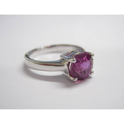 171 - A Pink Sapphire single stone Ring claw-set round stone, 2.47cts, in 18ct white gold, ring size L 1/2