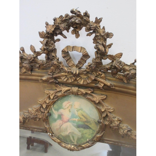 23 - A 19th Century French gilt framed Wall Mirror with ribbon and rose surmount above a painted panel of... 