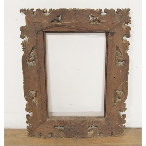 305 - An Italian 19th Century fruit wood carved Frame, in the baroque style, rebate size 24 x 16in