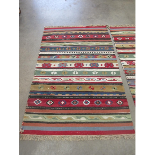 350 - Two woollen North African multi-coloured Rugs both 7ft x 4ft 4in