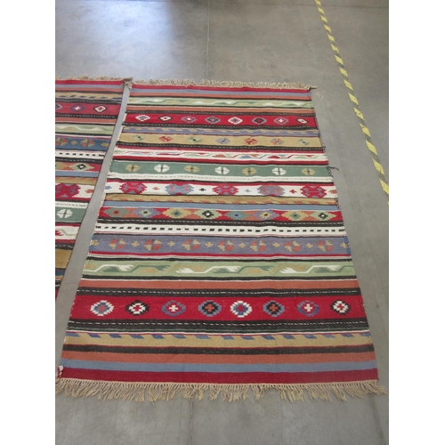 350 - Two woollen North African multi-coloured Rugs both 7ft x 4ft 4in