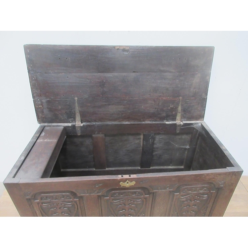 363 - An 18th Century oak Mule Chest with three carved panels above two drawers 4ft W x 2ft 1on H