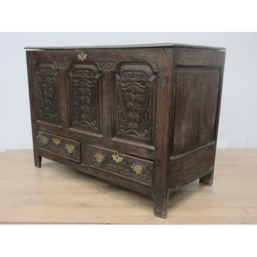 363 - An 18th Century oak Mule Chest with three carved panels above two drawers 4ft W x 2ft 1on H