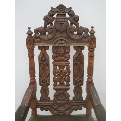 366 - A Victorian carved oak Armchair with leather seat 4ft H