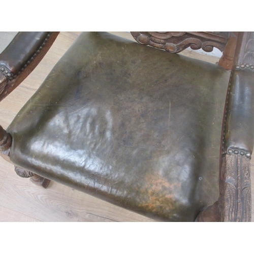 366 - A Victorian carved oak Armchair with leather seat 4ft H