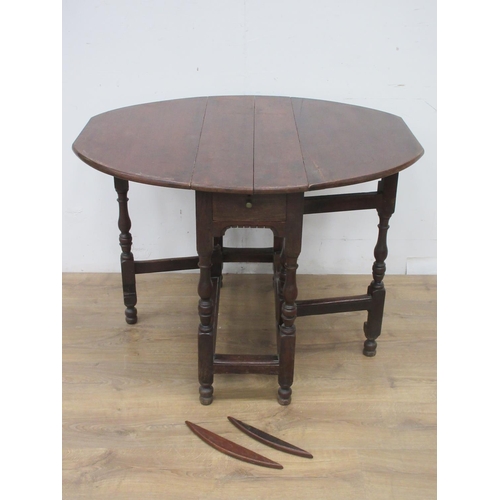 368 - An antique oak gateleg Table fitted end drawer on turned supports A/F 2ft 9in W x 2ft 3in H