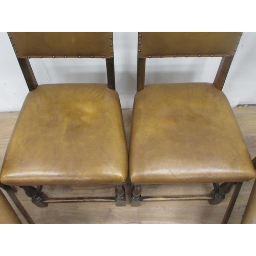 369 - A set of four leather effect covered oak Dining Chairs