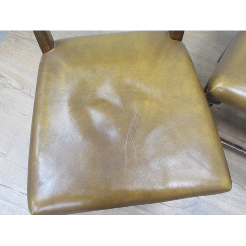 369 - A set of four leather effect covered oak Dining Chairs