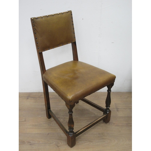 369 - A set of four leather effect covered oak Dining Chairs