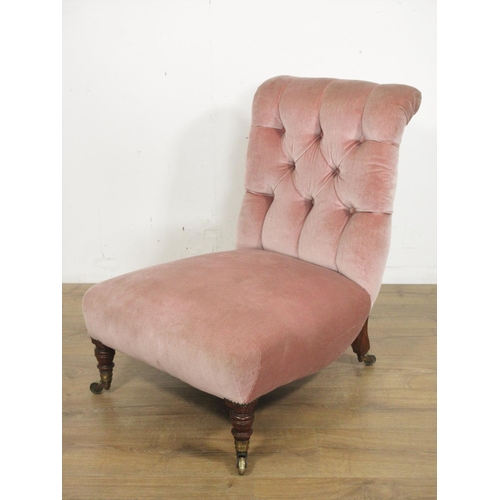 377 - A 19th Century pink upholstered button back Nursing Chair on turned front supports and casters, stam... 