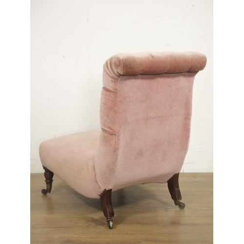 377 - A 19th Century pink upholstered button back Nursing Chair on turned front supports and casters, stam... 