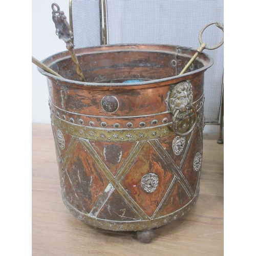 378 - A Regency brass Coal Bin with lion mask ring handles and lattice design with masks on spherical feet... 