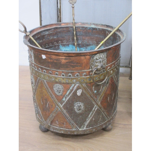 378 - A Regency brass Coal Bin with lion mask ring handles and lattice design with masks on spherical feet... 