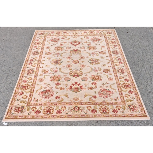 4 - A large cream ground Carpet with orange trailing floral design within tramline border 12ft L x9ft 2i... 