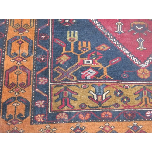 402 - A woollen red ground Rug with styilised floral decoration and brown border 7ft Lx 3ft 6in W approx