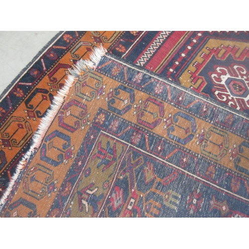 402 - A woollen red ground Rug with styilised floral decoration and brown border 7ft Lx 3ft 6in W approx