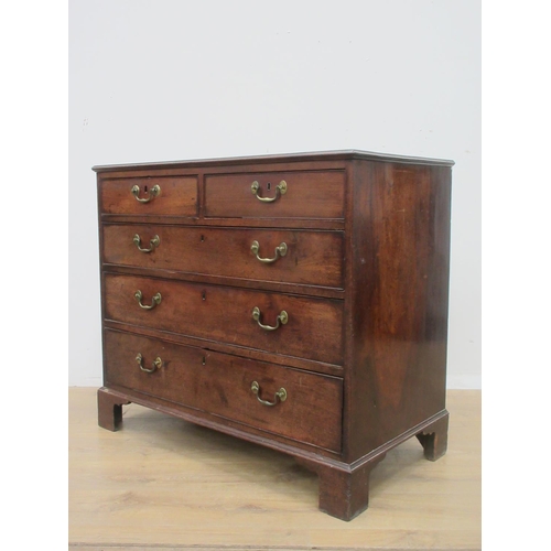 406 - A George III mahogany Chest of two short and three long drawers with moulded top mounted upon ogee b... 