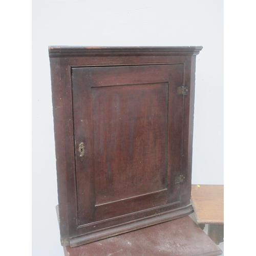 409 - An antique oak hanging Corner Cupboard, two oak Occasional Tables and a Chippendale style mahogany D... 