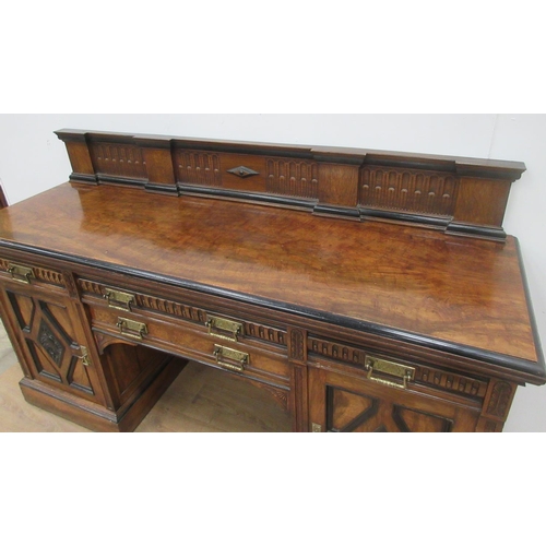 416 - An Aesthetic movement pedestal Sideboard fitted four frieze drawers and two cupboard doors on plinth... 