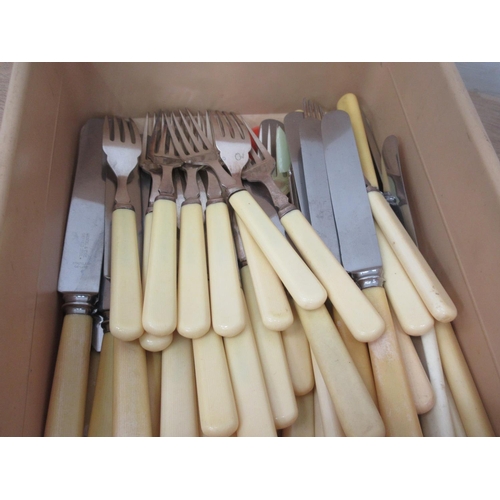 423 - A box of stainless Cutlery and Irish silver Tea Spoons, etc