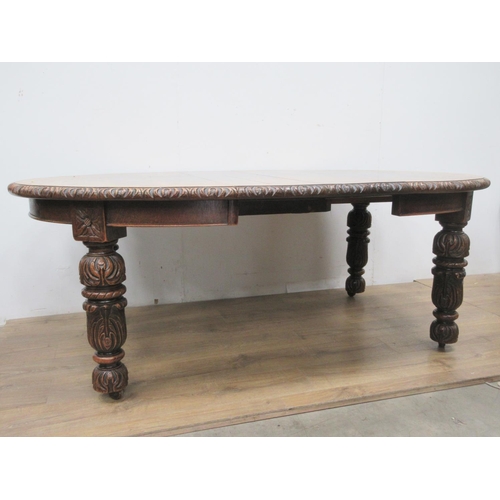 446 - A Victorian oak extending wind-out Dining Table with two spare leaves mounted upon carved supports 6... 