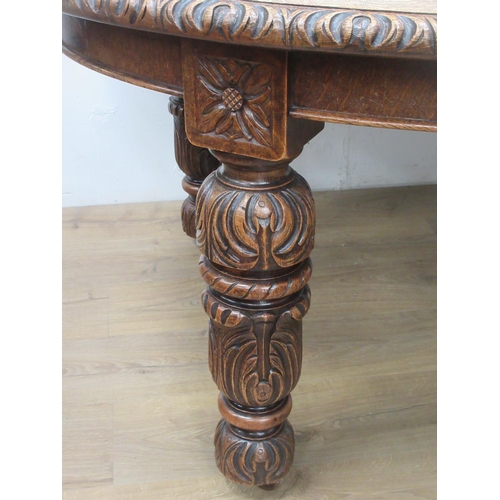 446 - A Victorian oak extending wind-out Dining Table with two spare leaves mounted upon carved supports 6... 