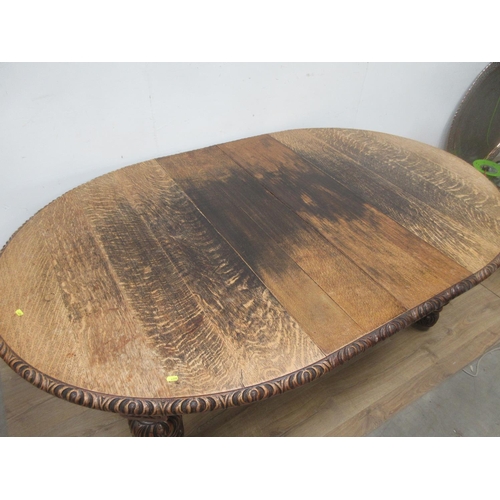 446 - A Victorian oak extending wind-out Dining Table with two spare leaves mounted upon carved supports 6... 