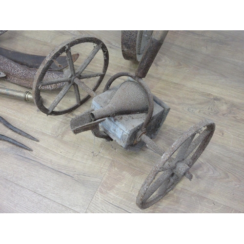 449 - A quantity of Scythes, Bill Hook, Sheers, Seed Drill and other agricultural implements