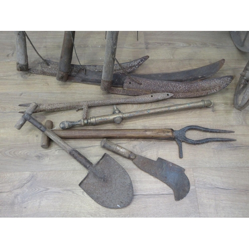 449 - A quantity of Scythes, Bill Hook, Sheers, Seed Drill and other agricultural implements