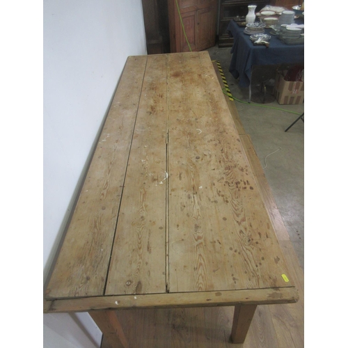 461 - An antique pine Farmhouse Table with cleated top on square cut tapering supports 8ft 2in L x 2ft 8in... 