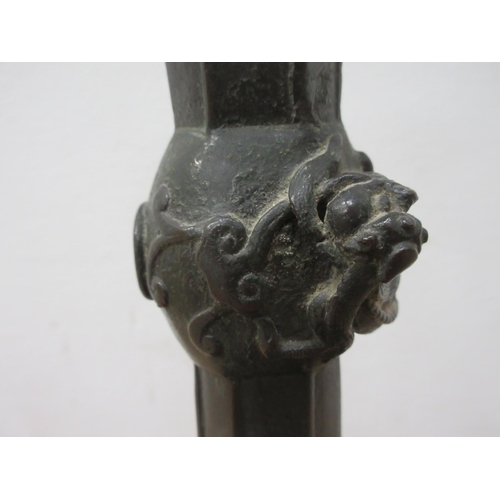 496 - An oriental Candlestick with lizard decoration 10 1/2in H