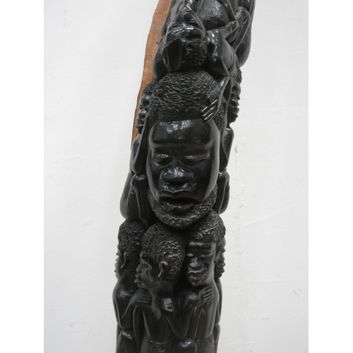 512 - A Makonde ebony carving of climbing figures 5ft 4in L