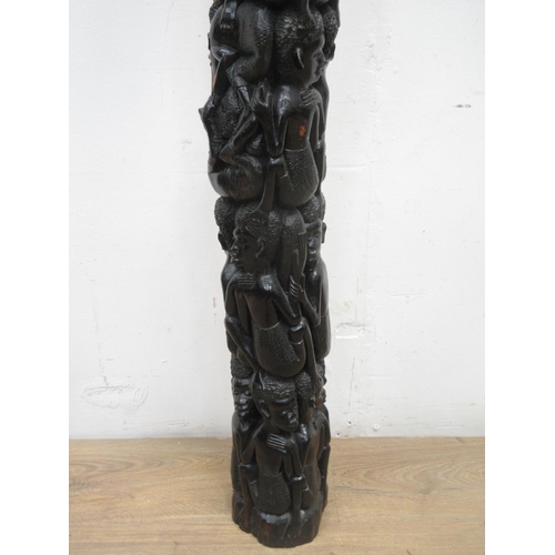 512 - A Makonde ebony carving of climbing figures 5ft 4in L