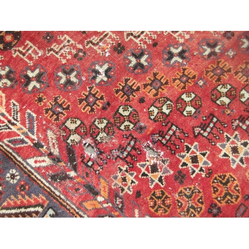 1 - A red ground woollen Rug A/F 8ft6in L x 5ft 2in W approx