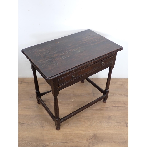 102 - An late 17th/early 18th Century elm Side Table with moulded top above channel carved frieze drawer m... 