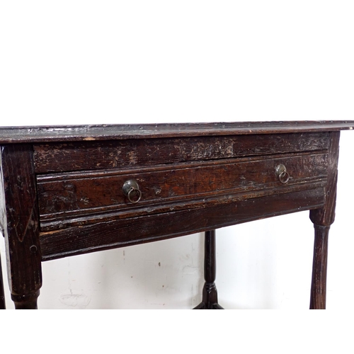 102 - An late 17th/early 18th Century elm Side Table with moulded top above channel carved frieze drawer m... 