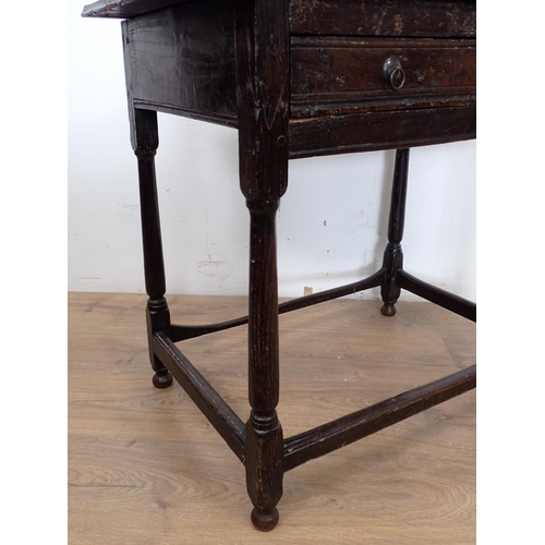 102 - An late 17th/early 18th Century elm Side Table with moulded top above channel carved frieze drawer m... 