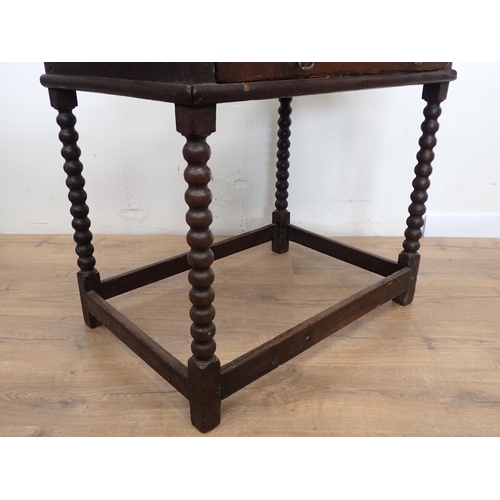 106 - A late 17th Century oak Side Table fitted single frieze drawer mounted upon bobbin turned supports 2... 