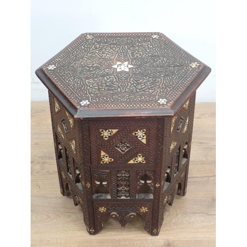 11 - A North African carved hardwood and mother of pearl inlaid hexagonal Table 1ft 10in W x 1ft 9in H